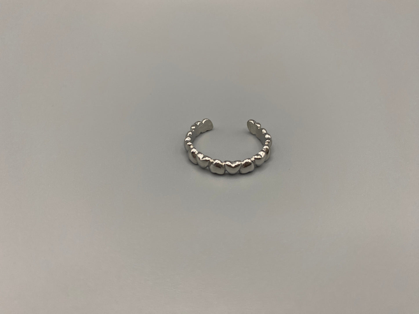 Bianca Stainless Steel Ring: Crafted from high-quality 316L stainless steel, this ring features a sleek, intertwined design that exudes sophistication. Available in size 7, it combines durability with a trendy, elegant pattern.