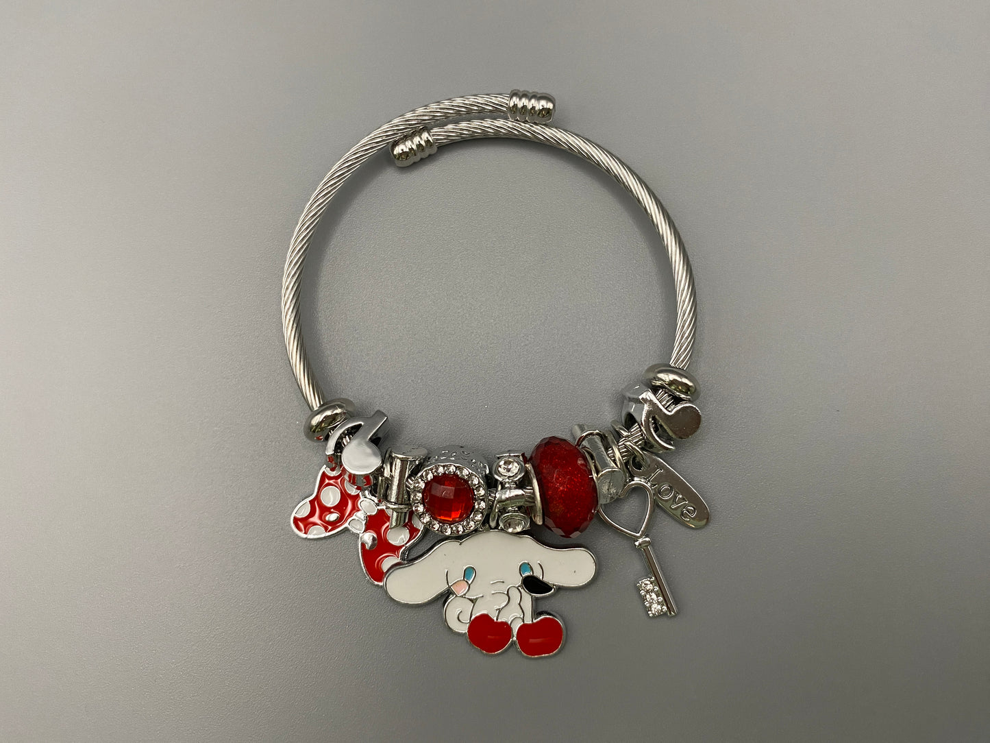 “Cartoon Character Bracelet in Red with a playful and stylish design, made from durable stainless steel, alloy charms, crystals, and glass beads. Adjustable 6cm diameter for a comfortable fit.”