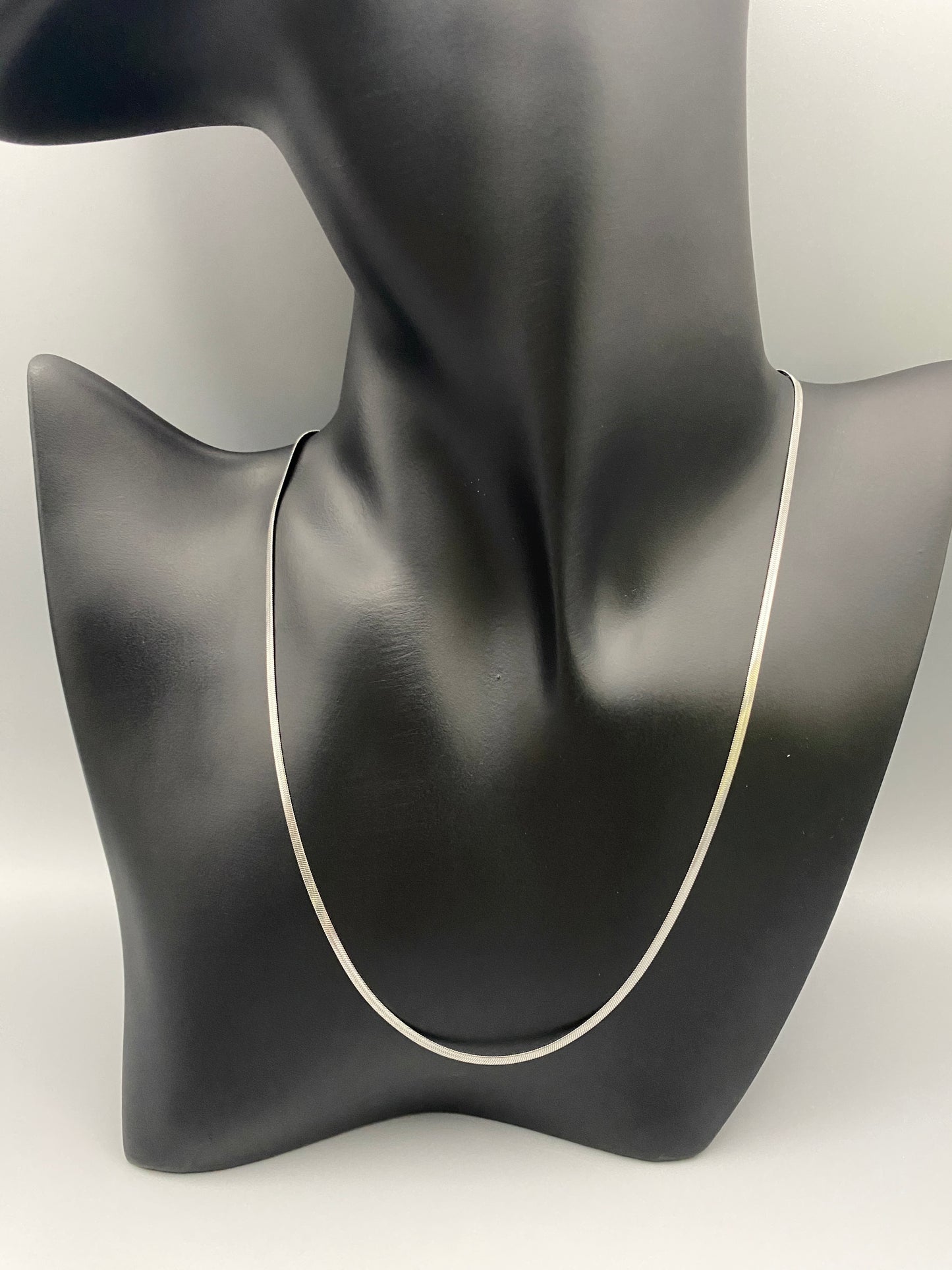 Dahlia Flat Snake Chain Silver Necklace. Sleek and sophisticated accessory. High-quality stainless steel, anti-tarnish, waterproof. Flat snake chain, 2mm width. Adjustable length: 40cm + 5cm extender. Modern and trendy design, perfect for layering or solo wear.