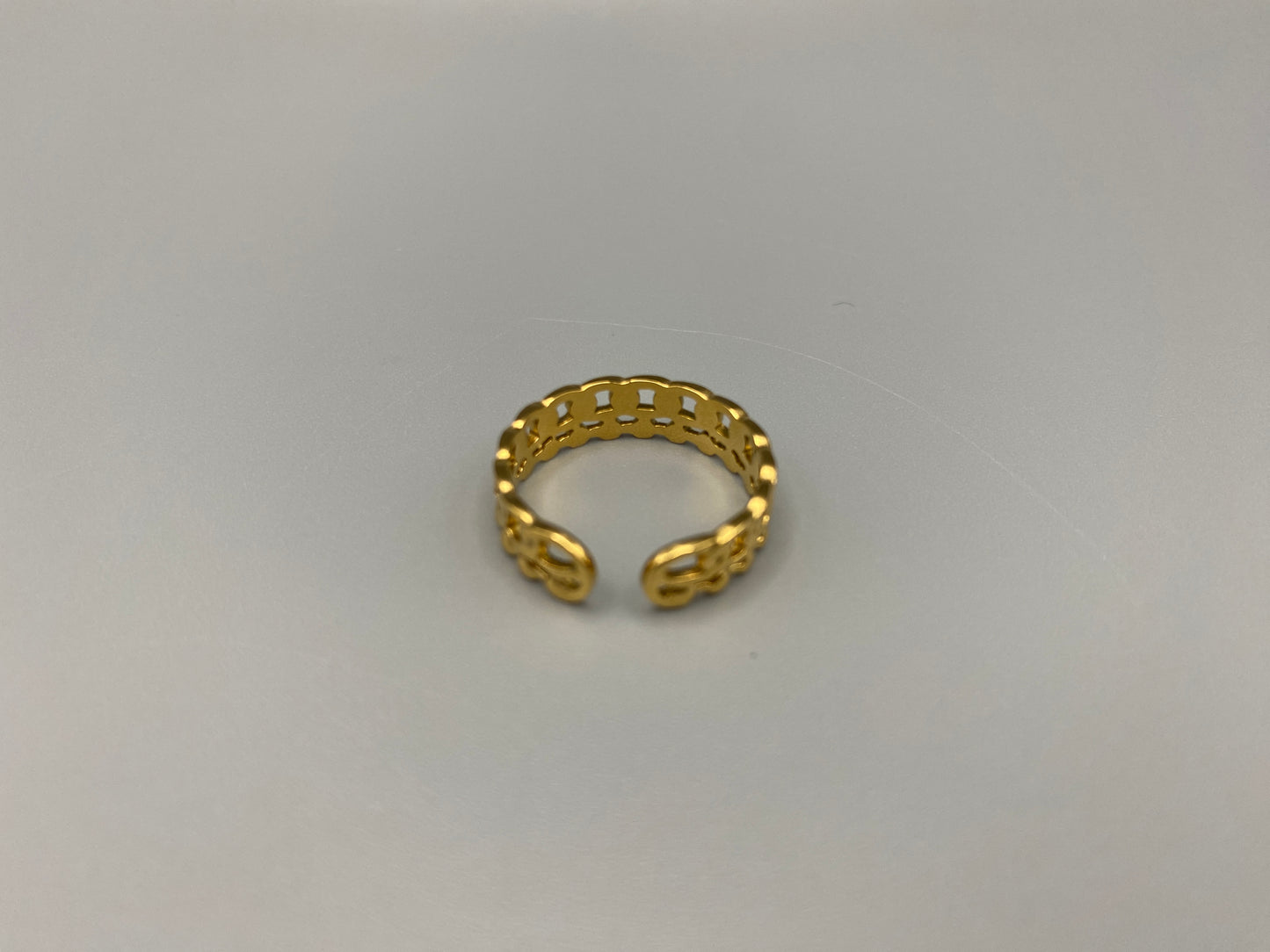 This unique ring features a dual chain design, creating an open and airy look that is both modern and elegant. The open hollow dual chain design adds a contemporary touch, while the gold plating ensures a luxurious finish. Made from durable titanium and stainless steel, it offers strength and longevity. Available in size 6, it provides a comfortable fit. Perfect for any occasion, this versatile accessory complements both casual and formal outfits.