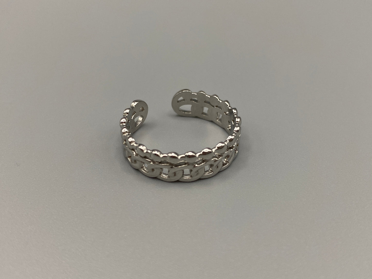 This unique ring features a dual chain design, creating an open and airy look that is both modern and elegant. The open hollow dual chain design adds a contemporary touch, while the plating ensures a luxurious finish. Made from durable titanium and stainless steel, it offers strength and longevity. Available in size 6, it provides a comfortable fit. Perfect for any occasion, this versatile accessory complements both casual and formal outfits.
