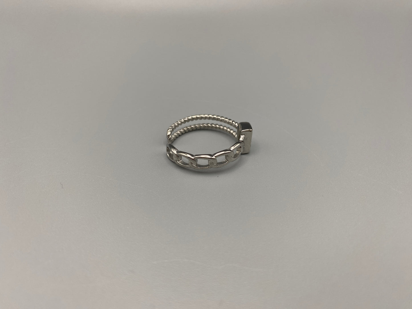 Breanna Adjustable Zirconia Ring: A stunning piece of jewellery that combines elegance and versatility. Made from high-quality 316L stainless steel, this ring features a sparkling zircon stone and an adjustable band for a perfect fit. The trendy design ensures it stands out, making it a must-have accessory.