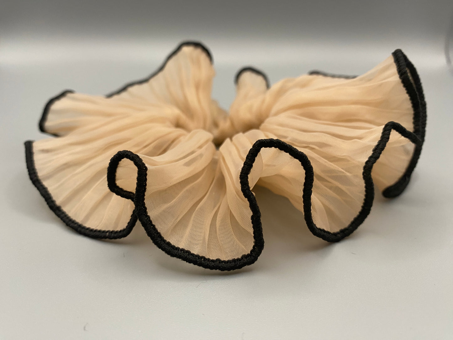 “Juliette Nude Colour French Style Scrunchie, a chic and elegant hair accessory perfect for various hairstyles. Made from high-quality material for durability and style.”