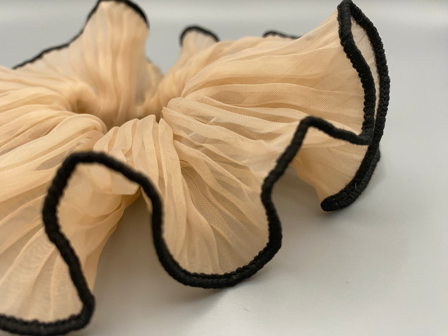 “Juliette Nude Colour French Style Scrunchie, a chic and elegant hair accessory perfect for various hairstyles. Made from high-quality material for durability and style.”