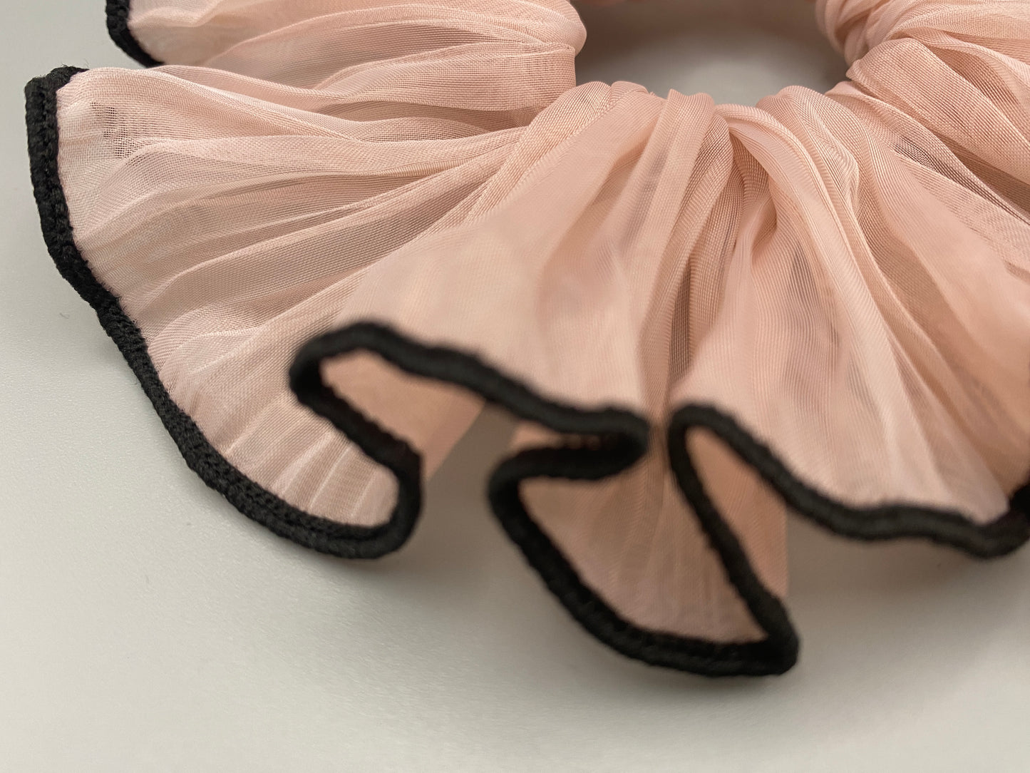 “Juliette Pink Colour French Style Scrunchie, a chic and elegant hair accessory perfect for various hairstyles. Made from high-quality material for durability and style.”