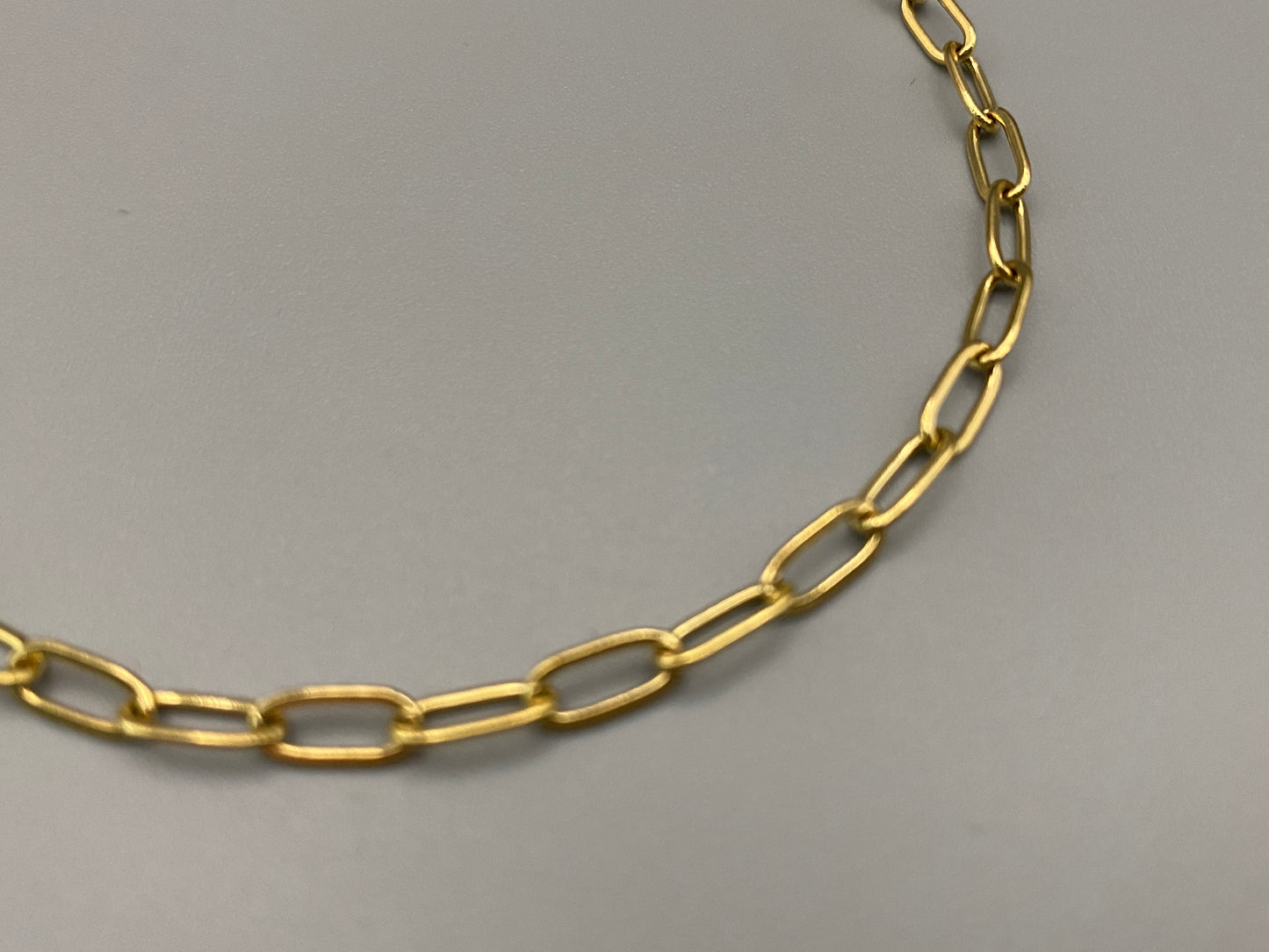 The Nexa Chain Link Bracelet is made of premium gold stainless steel with titanium steel construction and features a modern chain link design with gold PVD plating. It measures 17 cm with a 3 cm adjustment for a sleek, durable, and stylish look." elegant look."