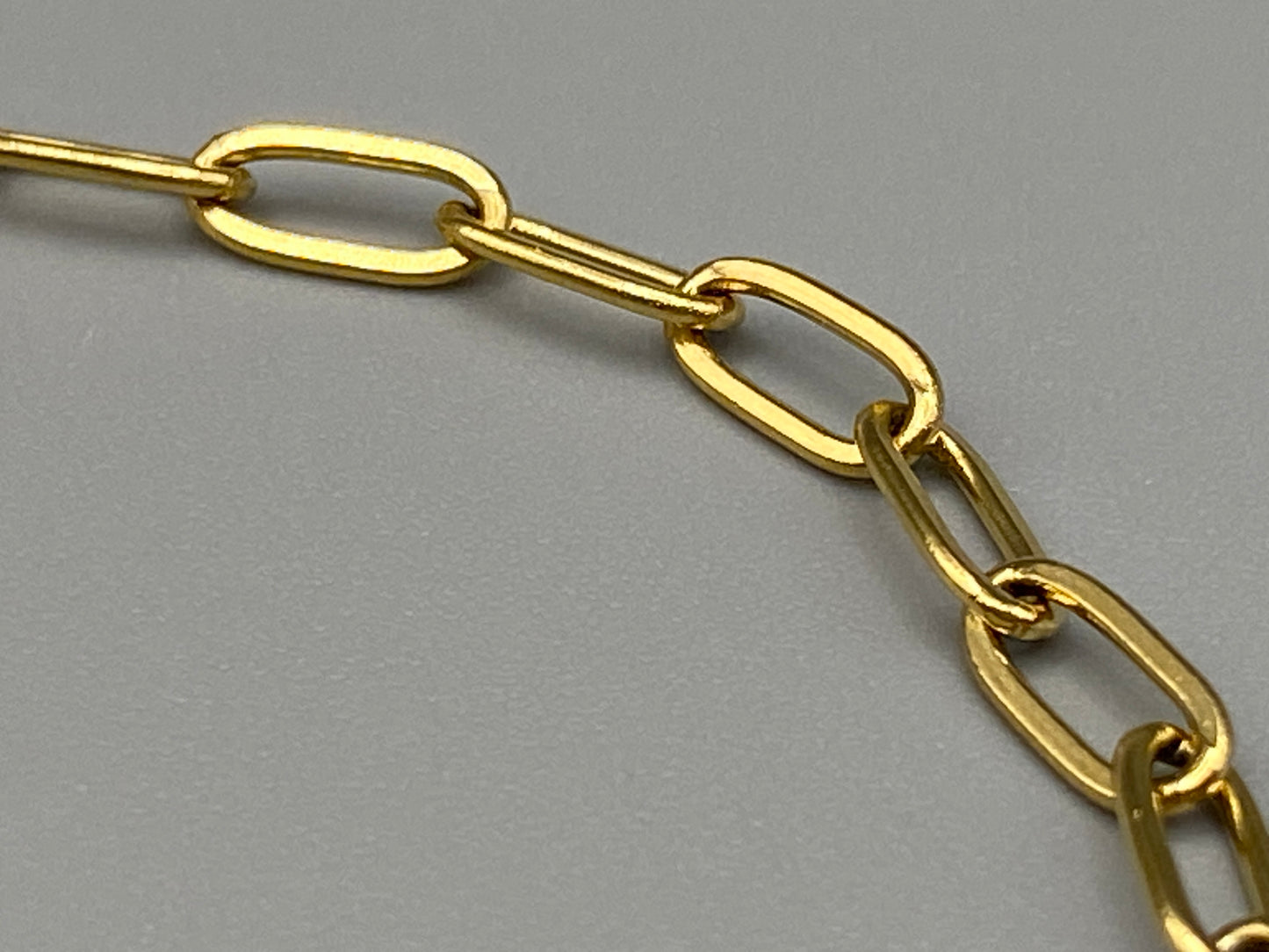 The Nexa Chain Link Bracelet is made of premium gold stainless steel with titanium steel construction and features a modern chain link design with gold PVD plating. It measures 17 cm with a 3 cm adjustment for a sleek, durable, and stylish look." elegant look."