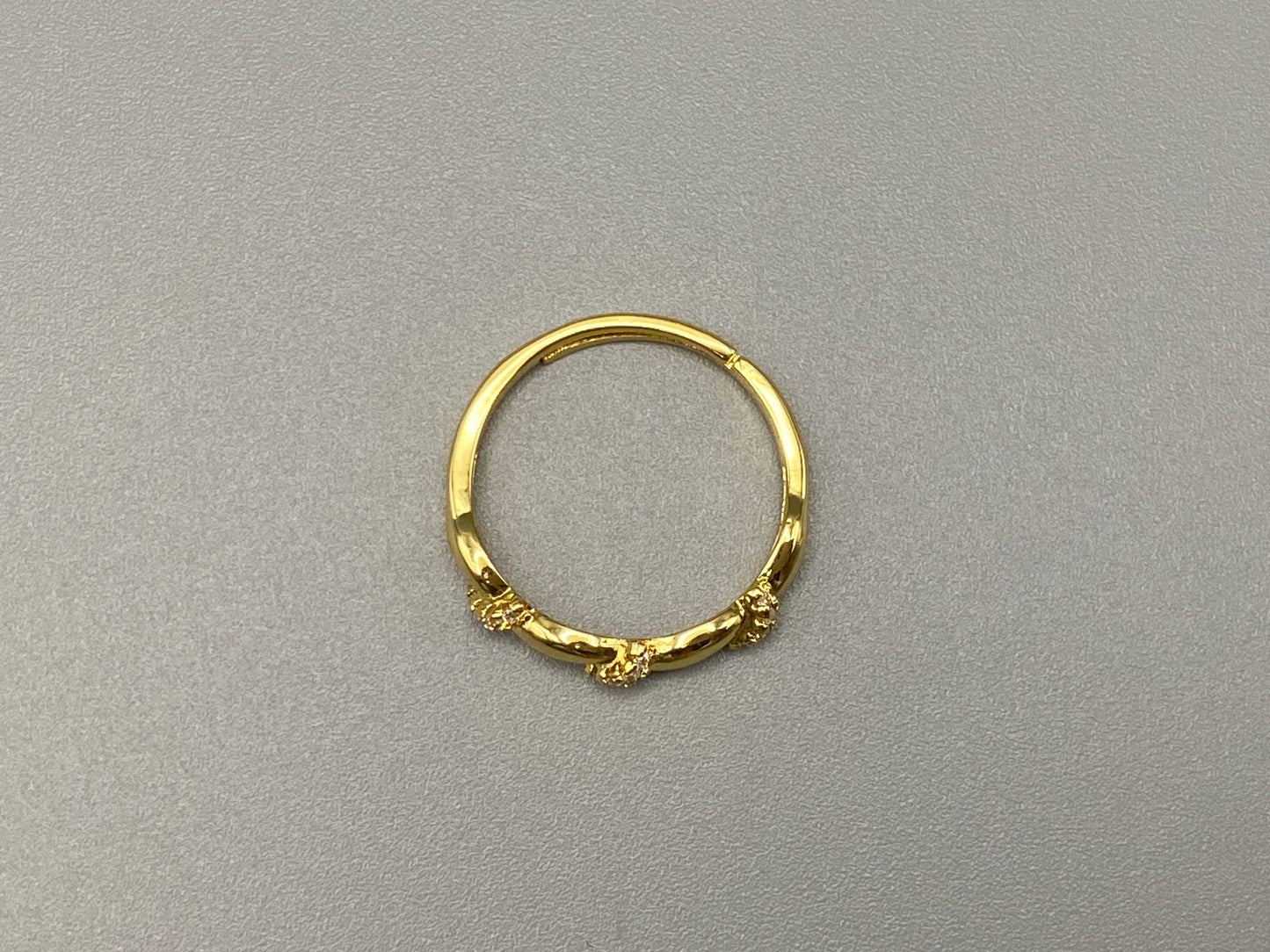 Olivia Adjustable Ring Gold: This exquisite piece is 18k gold plated, offering a luxurious shine and timeless appeal. The ring is waterproof and non-tarnish, ensuring it maintains its beauty over time. Cubic zirconia accents add sparkle and elegance, while the adjustable design ensures a perfect fit for any finger size. Make a statement with this stunning piece that complements any look.