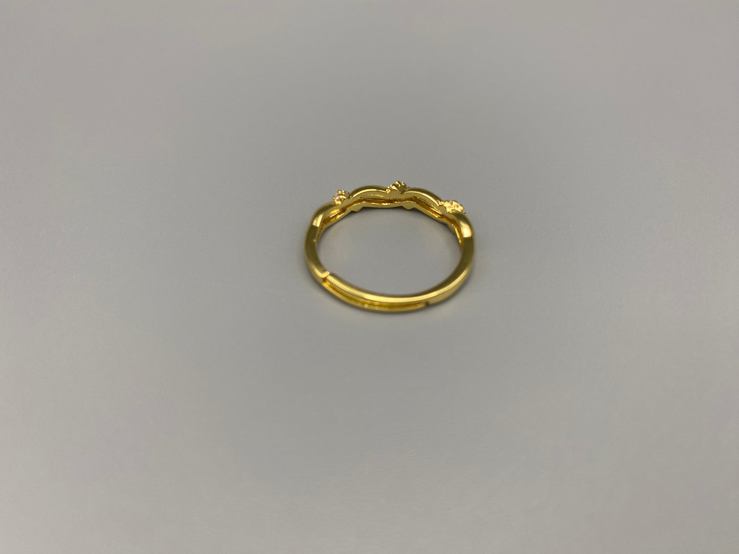Olivia Adjustable Ring Gold: This exquisite piece is 18k gold plated, offering a luxurious shine and timeless appeal. The ring is waterproof and non-tarnish, ensuring it maintains its beauty over time. Cubic zirconia accents add sparkle and elegance, while the adjustable design ensures a perfect fit for any finger size. Make a statement with this stunning piece that complements any look.