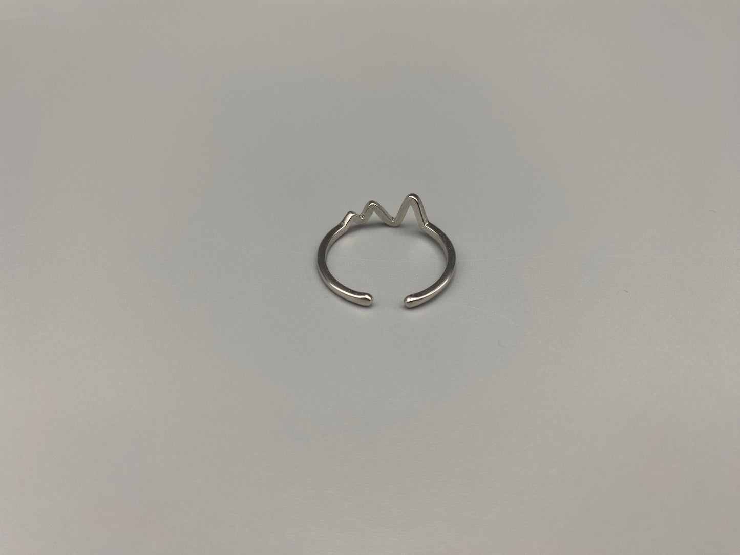 Pulse Ring Silver: This adjustable ring features a heartbeat pattern, crafted from high-quality 925 sterling silver and plated with a non-tarnish, waterproof finish. It is designed to be anti-allergy, making it perfect for any occasion, whether it’s an anniversary, engagement, wedding, or party.