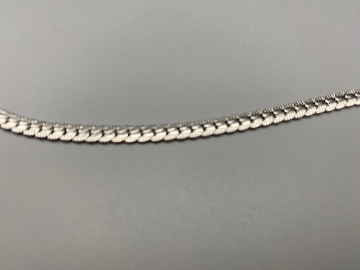 “Seraphina Bracelet in Silver with a unique snake-linked design, featuring luxurious Silver plating. Adjustable length of 17 cm with a 3 cm extension. Durable construction ensures long-lasting wear and tarnish resistance.”