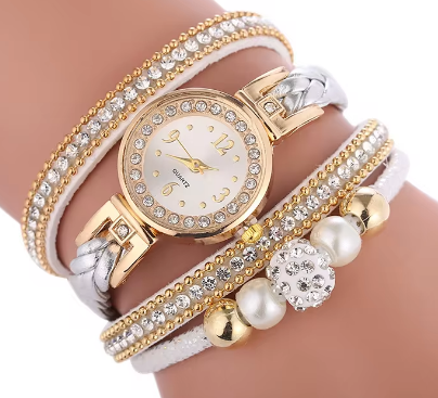 The Melissa Wrist Watch White and Gold. Exquisite timepiece with a crystal-studded dial in a sleek alloy case. Luxury quartz movement, genuine leather band, 35mm round case. Adjustable fit with 24cm band length. Non-waterproof. Perfect for charm, fashion, luxury, and antique looks.