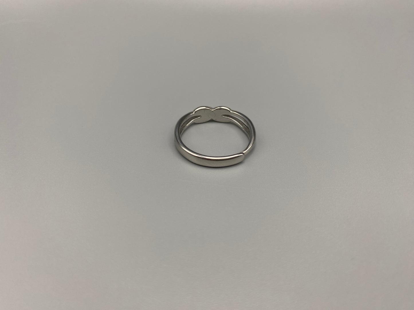 Tiana Silver Ring: Crafted from high-quality 316L stainless steel, this ring features a sleek, intertwined design that exudes sophistication. The adjustable, free-size band ensures a comfortable fit for any finger. Perfect for adding a trendy touch to any outfit.