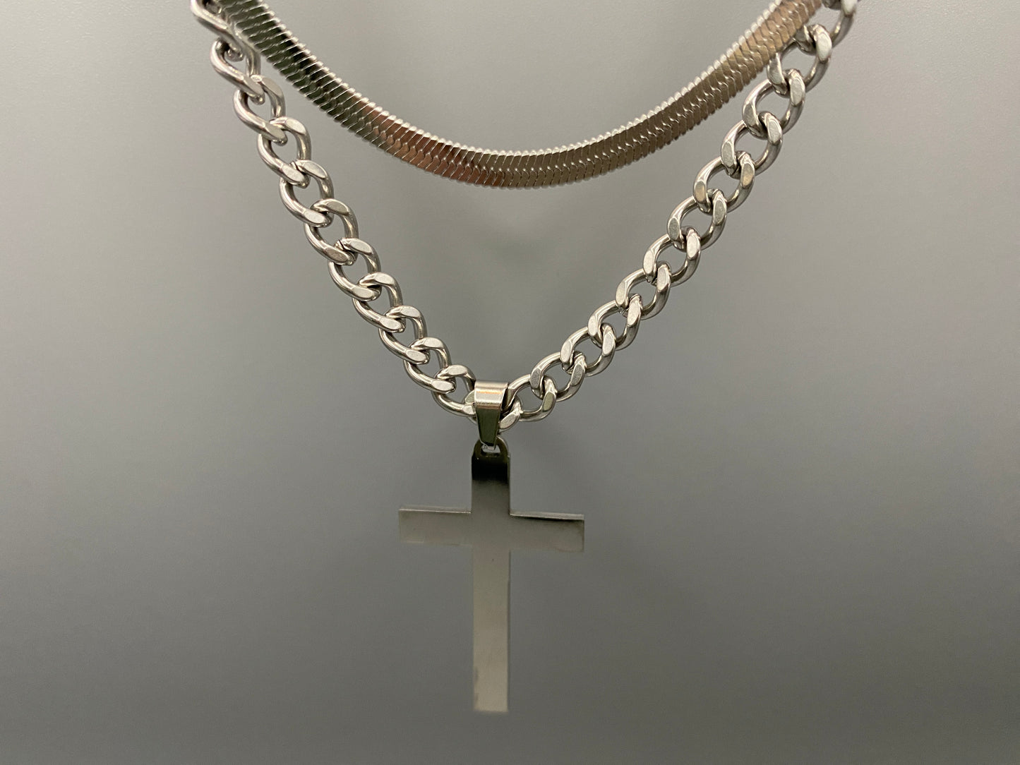 This elegant twin chain cross necklace features a striking black cross pendant, perfect for adding a touch of sophistication to any outfit. The necklace combines a thicker rope chain with a thinner snake chain, offering a unique and stylish look. Crafted from high-quality stainless steel, this piece is designed to last and maintain its shine.
Key Attributes:
Jewelry Main Material: Stainless steel
Shape/Pattern: Cross
Chain Length: Cross chain 25cm, Snake chain length 45 cm + 5 cm exte