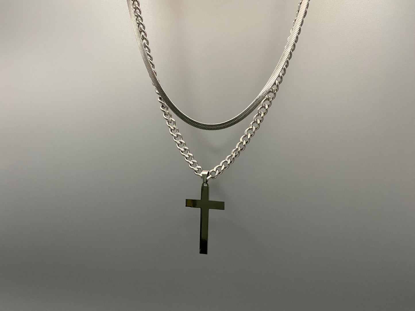 This elegant twin chain cross necklace features a striking black cross pendant, perfect for adding a touch of sophistication to any outfit. The necklace combines a thicker rope chain with a thinner snake chain, offering a unique and stylish look. Crafted from high-quality stainless steel, this piece is designed to last and maintain its shine.
Key Attributes:
Jewelry Main Material: Stainless steel
Shape/Pattern: Cross
Chain Length: Cross chain 25cm, Snake chain length 45 cm + 5 cm exte