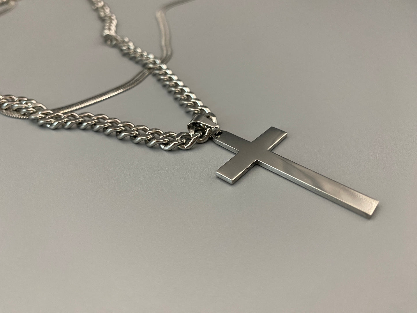 This elegant twin chain cross necklace features a striking black cross pendant, perfect for adding a touch of sophistication to any outfit. The necklace combines a thicker rope chain with a thinner snake chain, offering a unique and stylish look. Crafted from high-quality stainless steel, this piece is designed to last and maintain its shine.
Key Attributes:
Jewelry Main Material: Stainless steel
Shape/Pattern: Cross
Chain Length: Cross chain 25cm, Snake chain length 45 cm + 5 cm exte