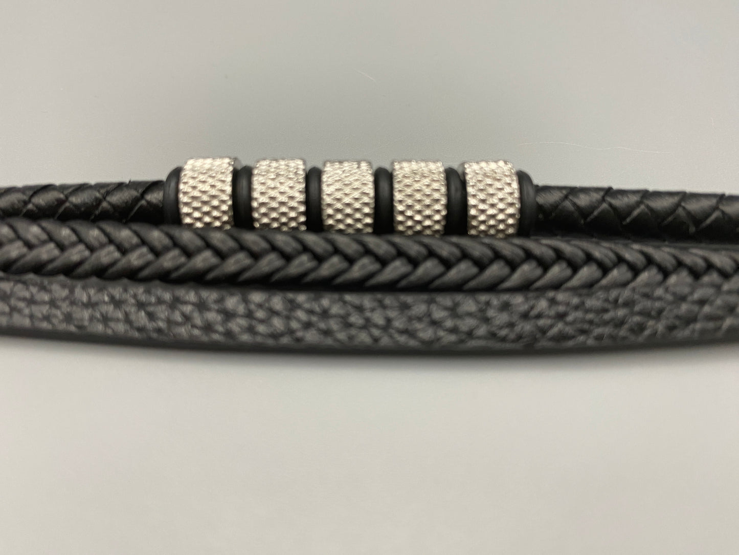“Urban Pulse Men’s Wrist Wear Bracelet in Black and Silver, featuring a sleek design with alternating black and silver links, perfect for adding a touch of modern elegance to any outfit.”