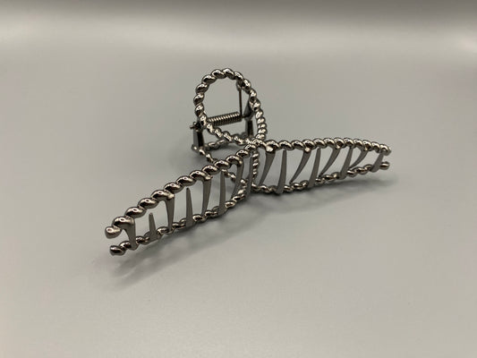 “Bellezza Claw Clip crafted from high-quality acrylic with a dark silver finish. Measures 11.5 cm in length, ideal for securing various hairstyles. Durable and stylish, perfect for both formal and casual occasions.”