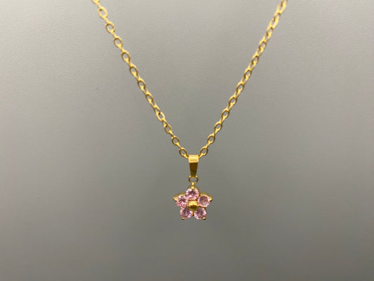 “Blossom Gold Pendant Necklace with a plum blossom design, featuring colourful pink cubic zirconia stones in a claw setting. Made from durable stainless steel with PVD gold plating. Measures 46 cm with a 5 cm adjustment.”