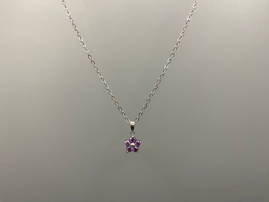 “Blossom Silver Pendant Necklace with a plum blossom design, featuring colourful cubic zirconia stones in a claw setting. Made from durable stainless steel with PVD plating. Measures 46 cm with a 5 cm adjustment.”