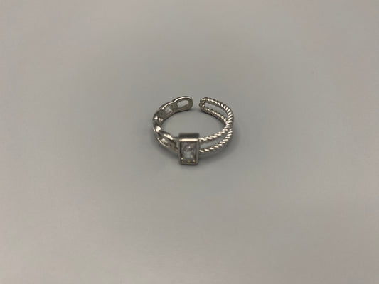 Breanna Adjustable Zirconia Ring: A stunning piece of jewellery that combines elegance and versatility. Made from high-quality 316L stainless steel, this ring features a sparkling zircon stone and an adjustable band for a perfect fit. The trendy design ensures it stands out, making it a must-have accessory.