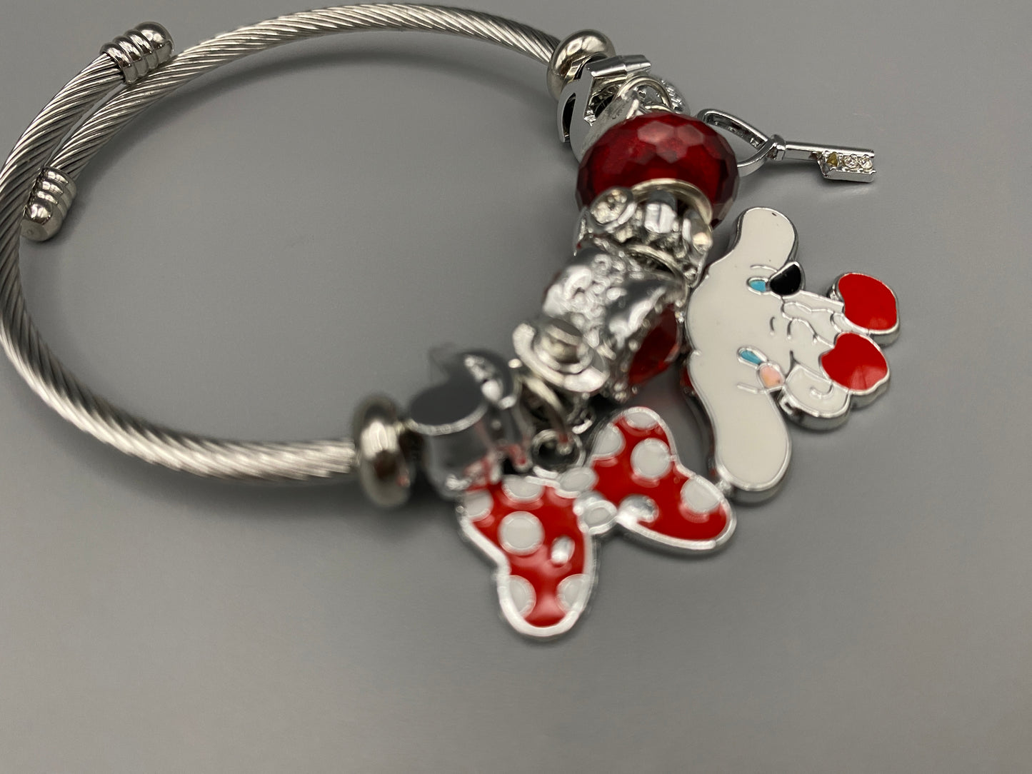 “Cartoon Character Bracelet in Red with a playful and stylish design, made from durable stainless steel, alloy charms, crystals, and glass beads. Adjustable 6cm diameter for a comfortable fit.”