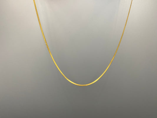 Dahlia Flat Snake Chain Gold Necklace. Sleek and modern design with a flat snake chain, perfect for adding elegance to any outfit. Key Features: Elegant Design: Flat snake chain with gold plating for a sophisticated look. Stainless Steel: Durable and tarnish-resistant. 18k Gold-Plated: Luxurious finish. Anti Tarnish & Waterproof: Maintains shine and luster over time. Size: 40 cm with a 5 cm extender for adjustable fit. Width: 2 mm for a delicate yet noticeable presence.