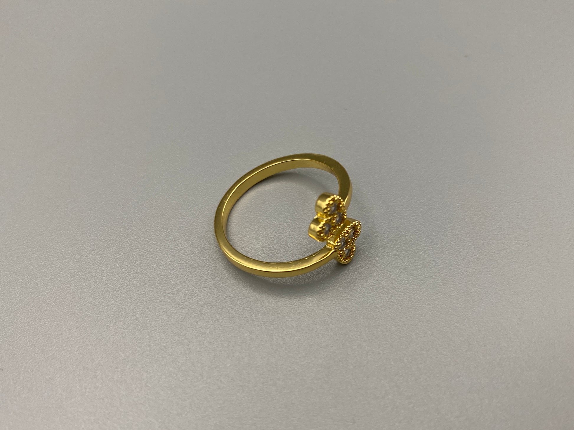 Dove Double Heart Adjustable Ring Gold: This beautiful ring features a double heart design, each adorned with sparkling zirconia stones. The elegant design, combined with 18k gold plating, creates a romantic and timeless look. The ring is non-tarnish, waterproof, nickel-free, and non-fading, ensuring it maintains its shine and is safe for sensitive skin. The adjustable size provides a comfortable fit for various finger sizes.