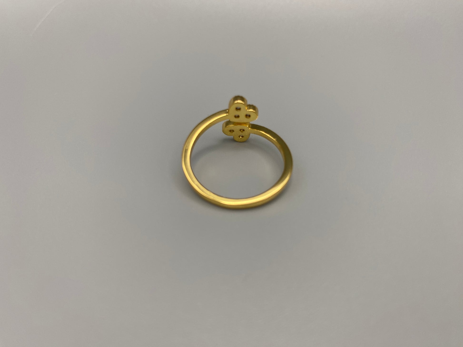 Dove Double Heart Adjustable Ring Gold: This beautiful ring features a double heart design, each adorned with sparkling zirconia stones. The elegant design, combined with 18k gold plating, creates a romantic and timeless look. The ring is non-tarnish, waterproof, nickel-free, and non-fading, ensuring it maintains its shine and is safe for sensitive skin. The adjustable size provides a comfortable fit for various finger sizes.
