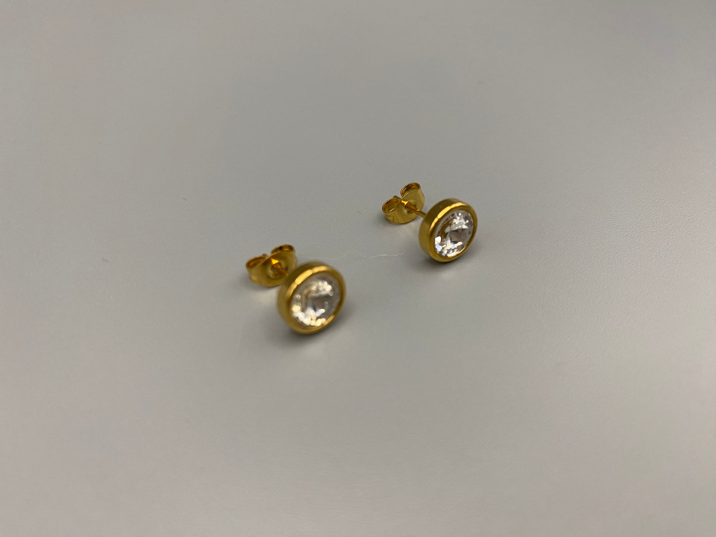 Chic stud earrings featuring dazzling AAA Zircon stones set in high-quality 304 stainless steel, gold plated, with an 8mm size and micro insert inlay technology. These earrings offer a perfect blend of elegance and durability.