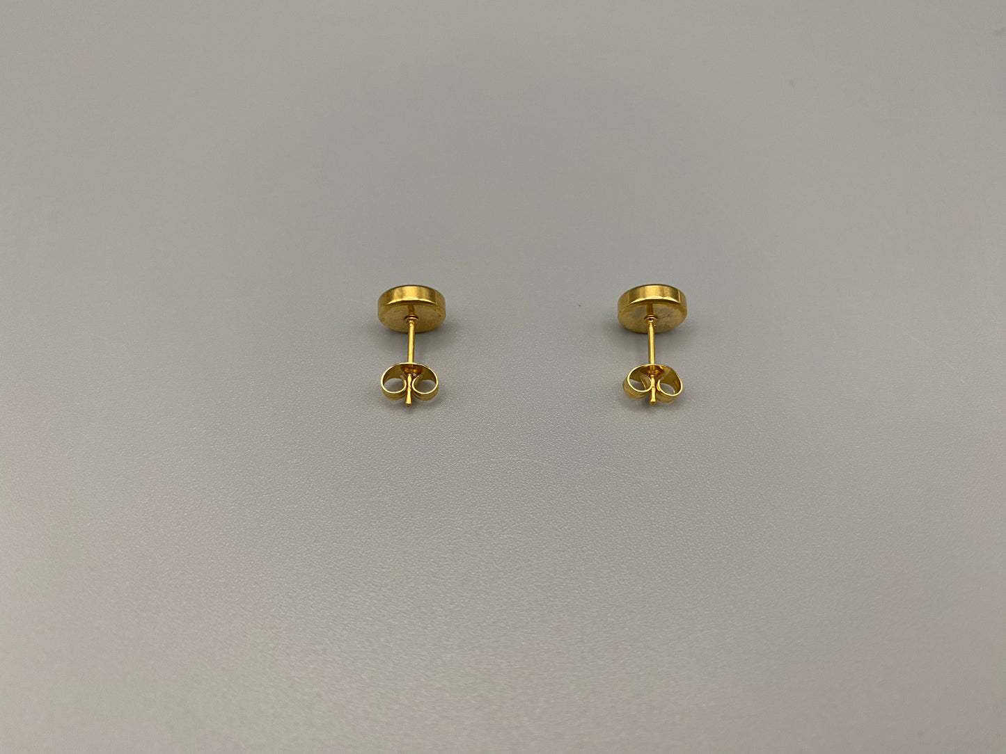 Chic stud earrings featuring dazzling AAA Zircon stones set in high-quality 304 stainless steel, gold plated, with an 8mm size and micro insert inlay technology. These earrings offer a perfect blend of elegance and durability.