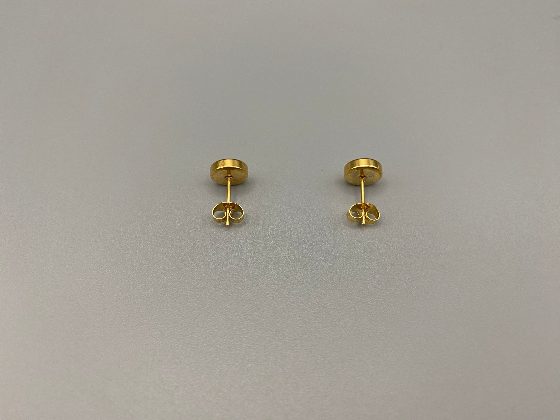 Chic stud earrings featuring dazzling AAA Zircon stones set in high-quality 304 stainless steel, gold plated, with an 8mm size and micro insert inlay technology. These earrings offer a perfect blend of elegance and durability.