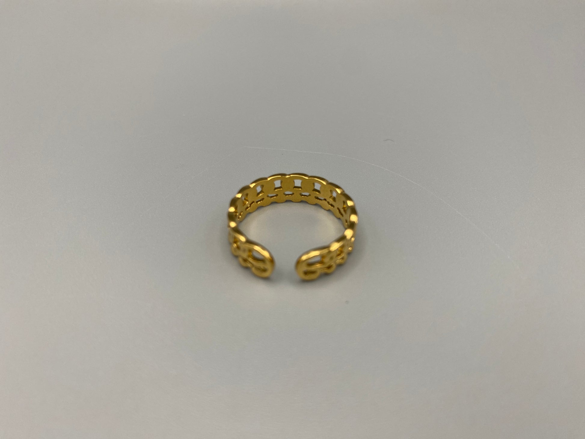 This unique ring features a dual chain design, creating an open and airy look that is both modern and elegant. The open hollow dual chain design adds a contemporary touch, while the gold plating ensures a luxurious finish. Made from durable titanium and stainless steel, it offers strength and longevity. Available in size 6, it provides a comfortable fit. Perfect for any occasion, this versatile accessory complements both casual and formal outfits.