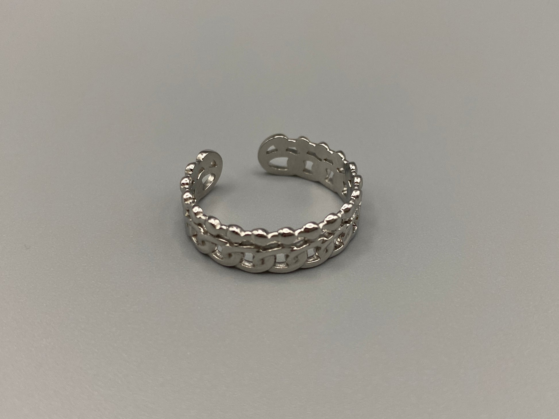 This unique ring features a dual chain design, creating an open and airy look that is both modern and elegant. The open hollow dual chain design adds a contemporary touch, while the plating ensures a luxurious finish. Made from durable titanium and stainless steel, it offers strength and longevity. Available in size 6, it provides a comfortable fit. Perfect for any occasion, this versatile accessory complements both casual and formal outfits.