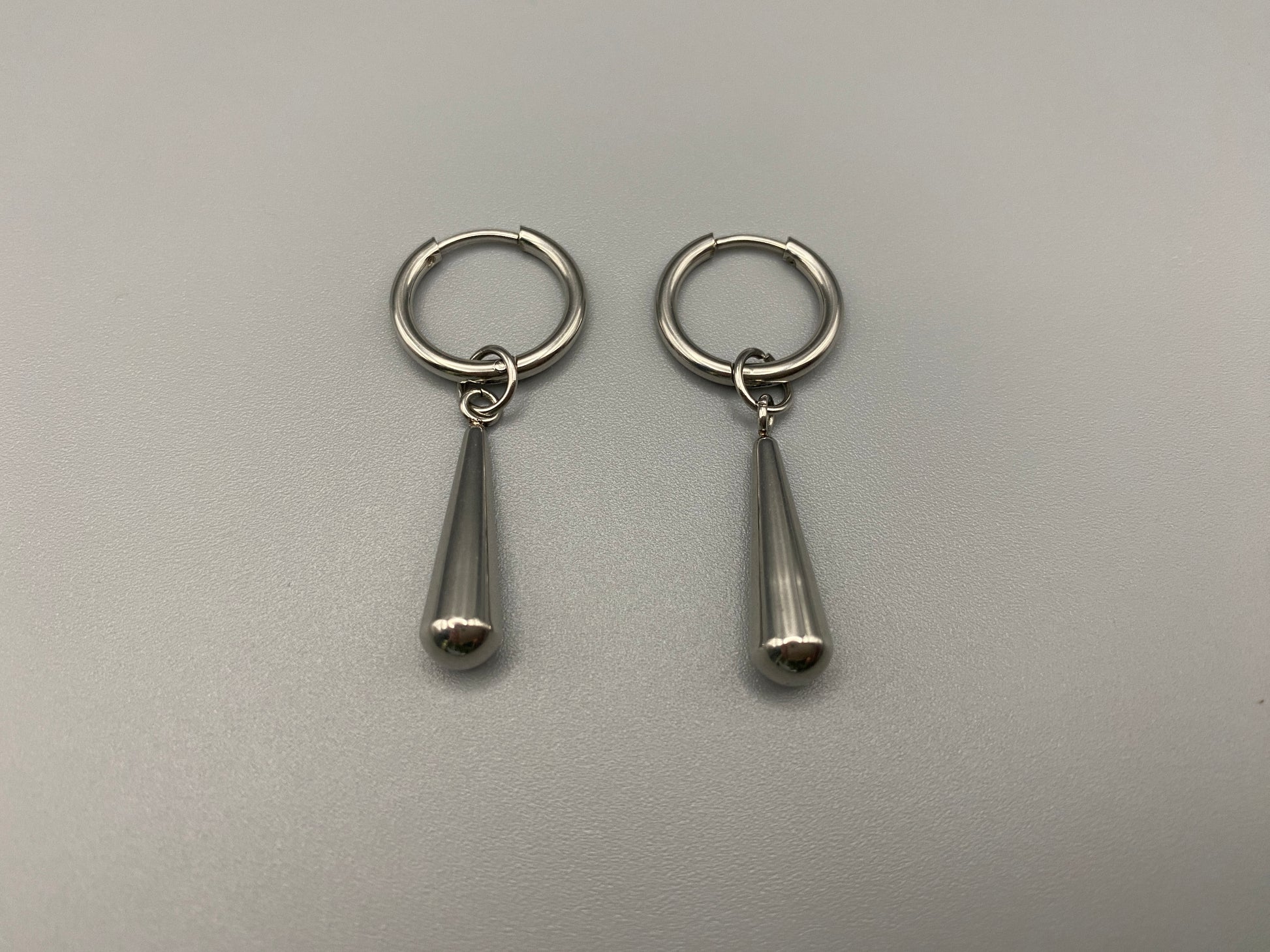Exquisite Elysian Teardrop Dangle Earrings crafted from high-quality stainless steel and silver plated. Featuring an elegant water drop shape, these earrings offer a timeless vintage style. Ideal for special occasions, they add a touch of sophistication to any outfit. Durable and long-lasting, perfect for elevating your style with classic design and modern craftsmanship.