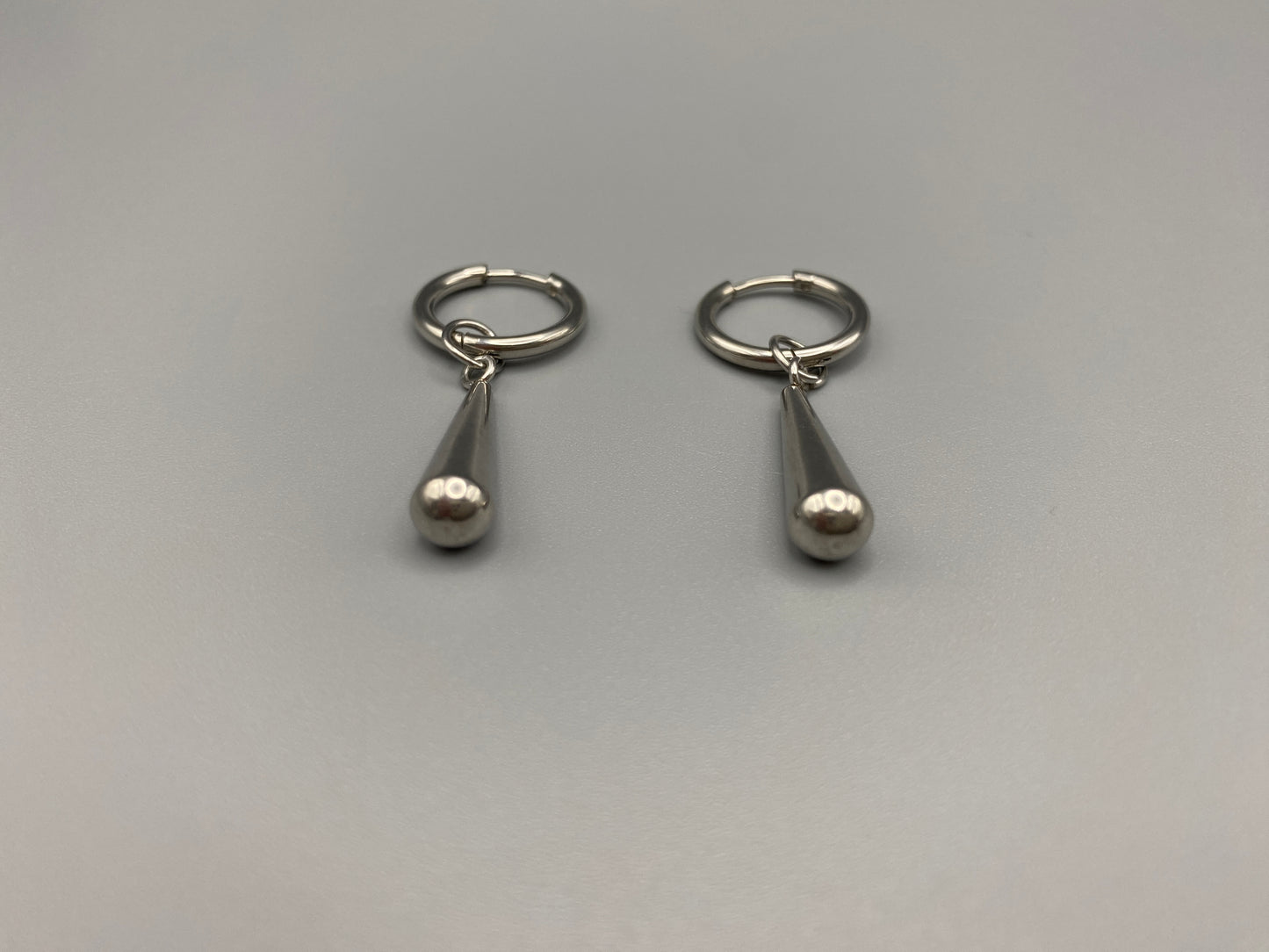 Exquisite Elysian Teardrop Dangle Earrings crafted from high-quality stainless steel and silver plated. Featuring an elegant water drop shape, these earrings offer a timeless vintage style. Ideal for special occasions, they add a touch of sophistication to any outfit. Durable and long-lasting, perfect for elevating your style with classic design and modern craftsmanship