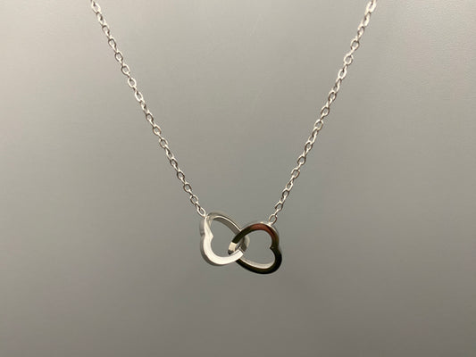 Eternity Twin Hearts Pendant Necklace Silver. Two intertwined hearts symbolizing eternal love. 18k gold, non-tarnish, waterproof, non-fade. Adjustable length: 41 cm + 5 cm extender. Elegant and versatile for any occasion.