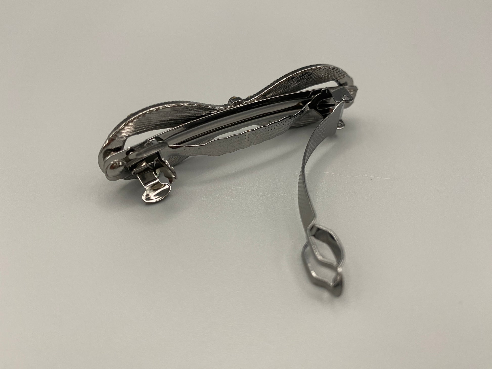 “Jasmine Dazzling Hair Pin in Silver Yellow with a rhinestone bow design featuring sparkling yellow zirconia inset stones. Measures 8x3x3 cm, crafted from high-quality metal for durability. Elegant and versatile, perfect for both special occasions and everyday wear.”