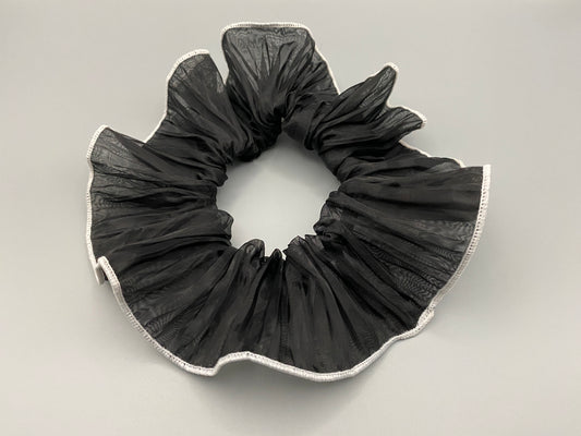 “Juliette Black Colour French Style Scrunchie, a chic and elegant hair accessory perfect for various hairstyles. Made from high-quality material for durability and style.”