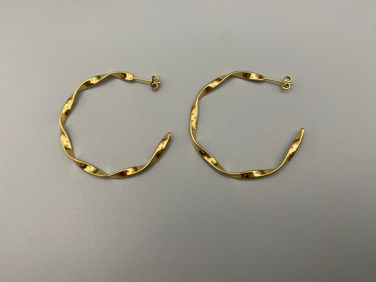 “Leanne C Shape Earrings Gold: Fashion-forward twisted wire earrings with an irregular C-shaped design, crafted from high-quality stainless steel and plated with luxurious 18K gold. Perfect for any occasion.”