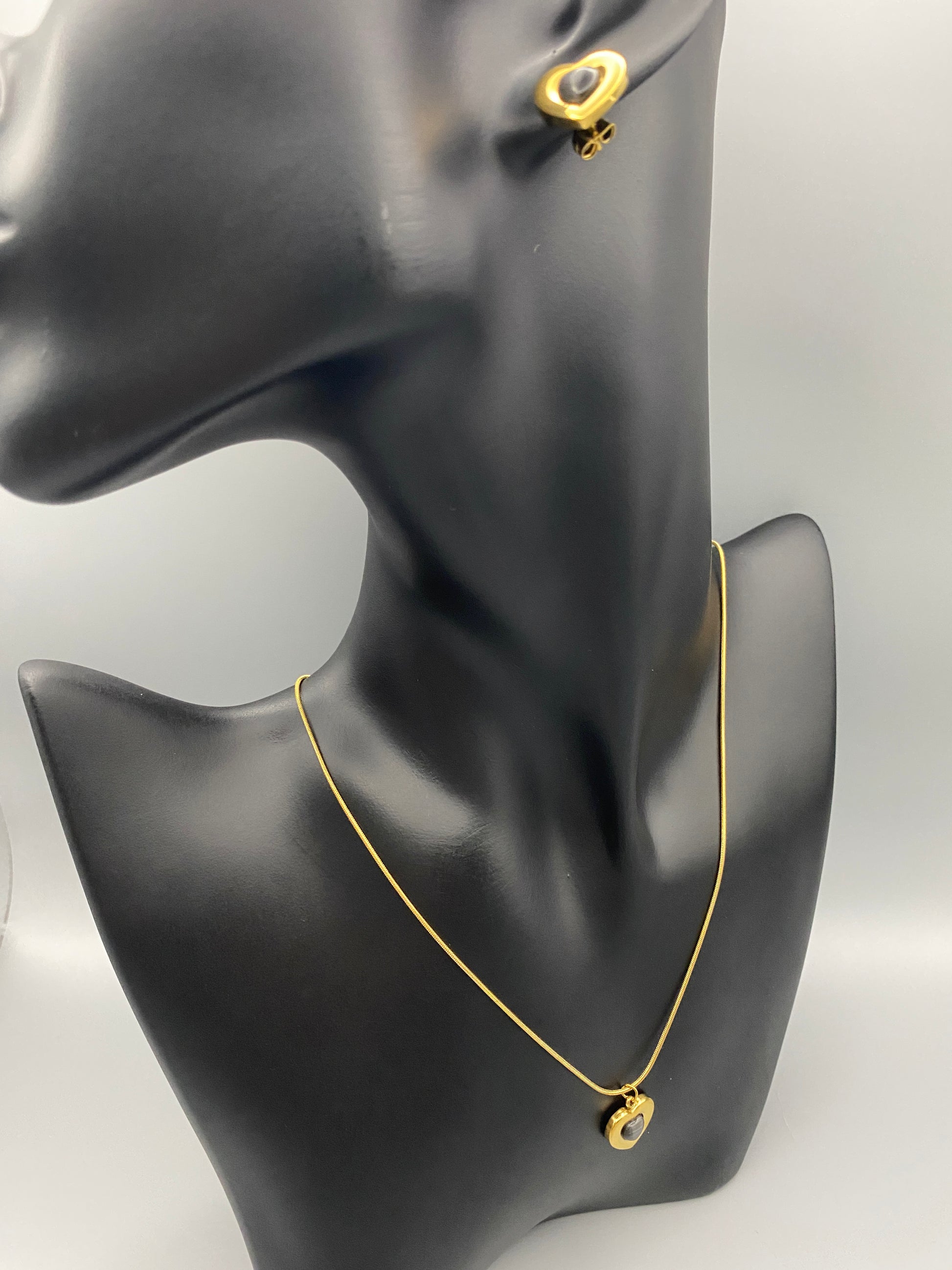 Lucia Heart Earrings Gold: Elegant and modern heart-shaped earrings featuring an obsidian stone, set in high-quality stainless steel and plated with 18K gold. Perfect for anniversaries, gifts, parties, and daily wear.”