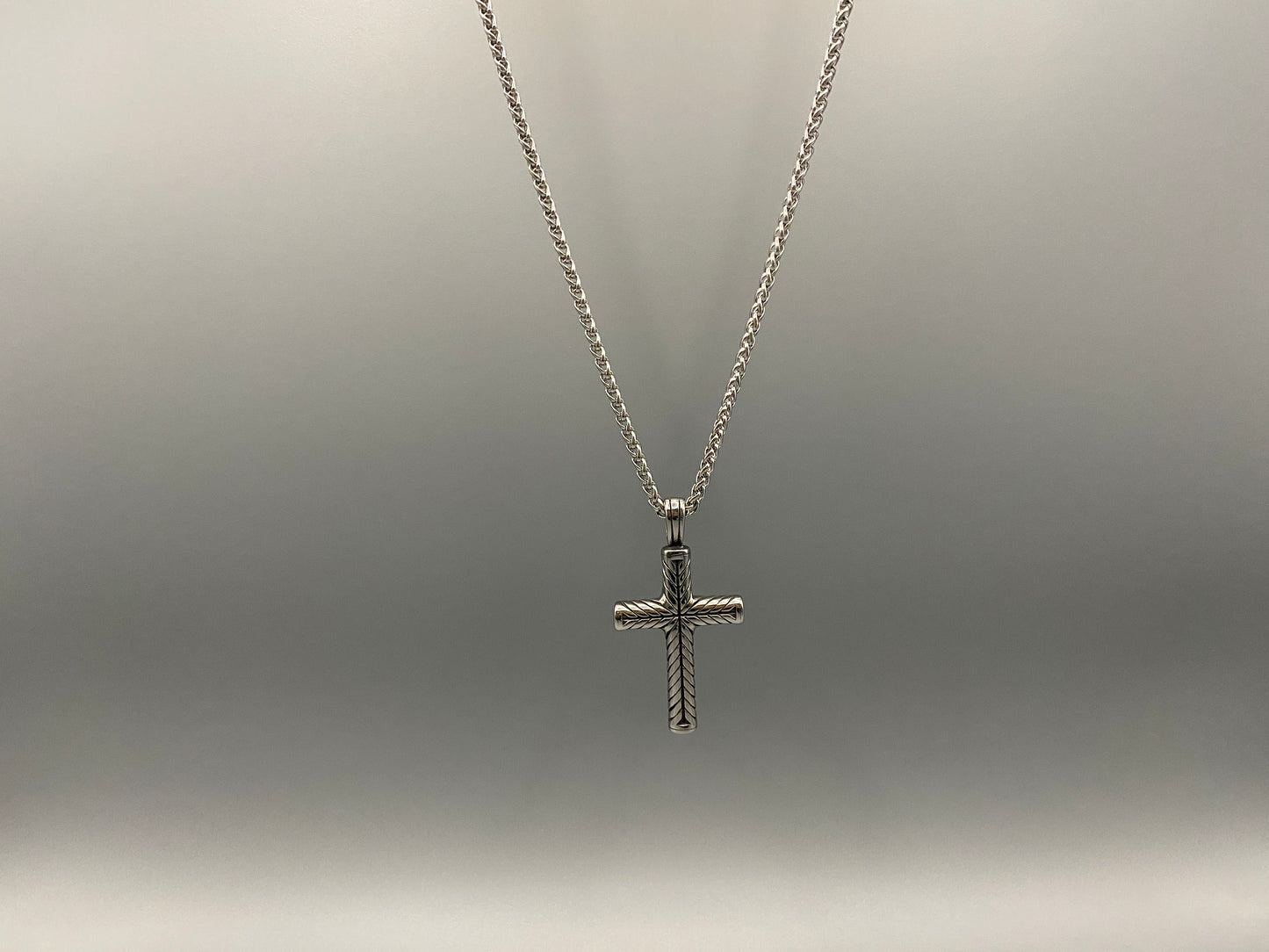 Faith Men’s Cross Chain Necklace. Timeless cross pendant in high-quality stainless steel. Durable, polished finish. Classic style for casual and formal wear. Unisex design. Length: 30 cm. Comfortable strand chain for all-day wear.