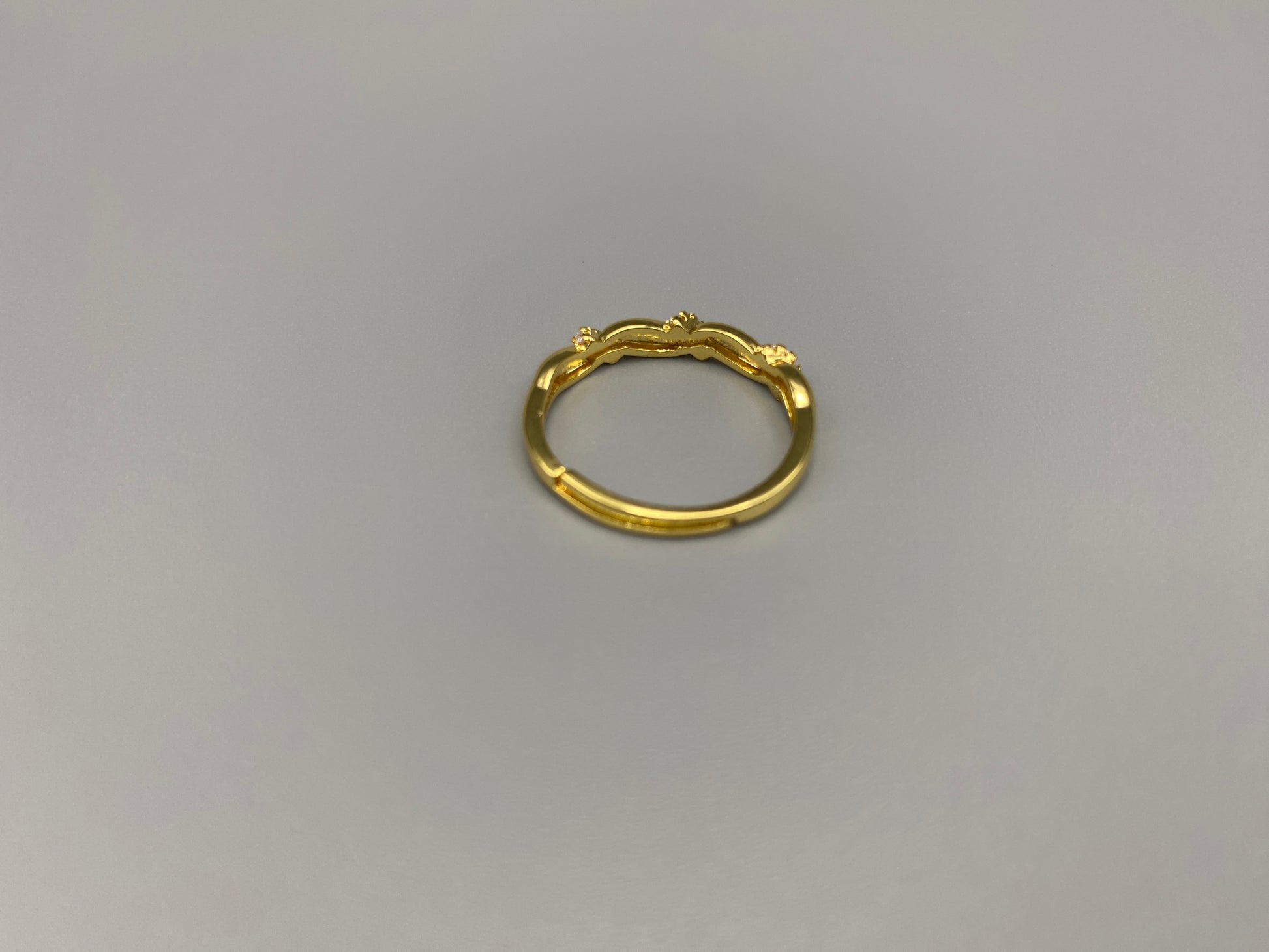 Olivia Adjustable Ring Gold: This exquisite piece is 18k gold plated, offering a luxurious shine and timeless appeal. The ring is waterproof and non-tarnish, ensuring it maintains its beauty over time. Cubic zirconia accents add sparkle and elegance, while the adjustable design ensures a perfect fit for any finger size. Make a statement with this stunning piece that complements any look.