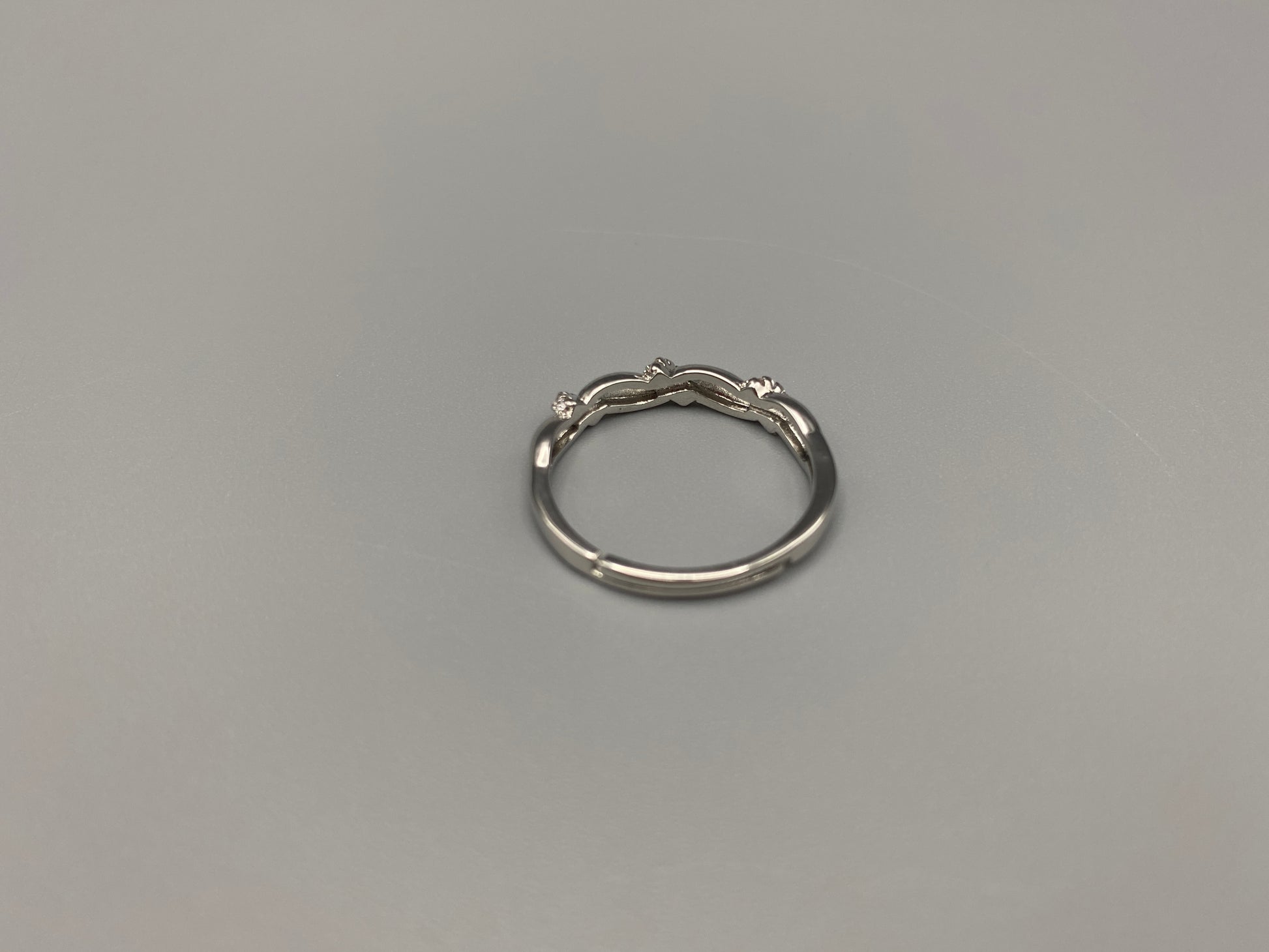 Olivia Adjustable Ring Silver: This exquisite piece plated, offering a luxurious shine and timeless appeal. The ring is waterproof and non-tarnish, ensuring it maintains its beauty over time. Cubic zirconia accents add sparkle and elegance, while the adjustable design ensures a perfect fit for any finger size. Make a statement with this stunning piece that complements any look.