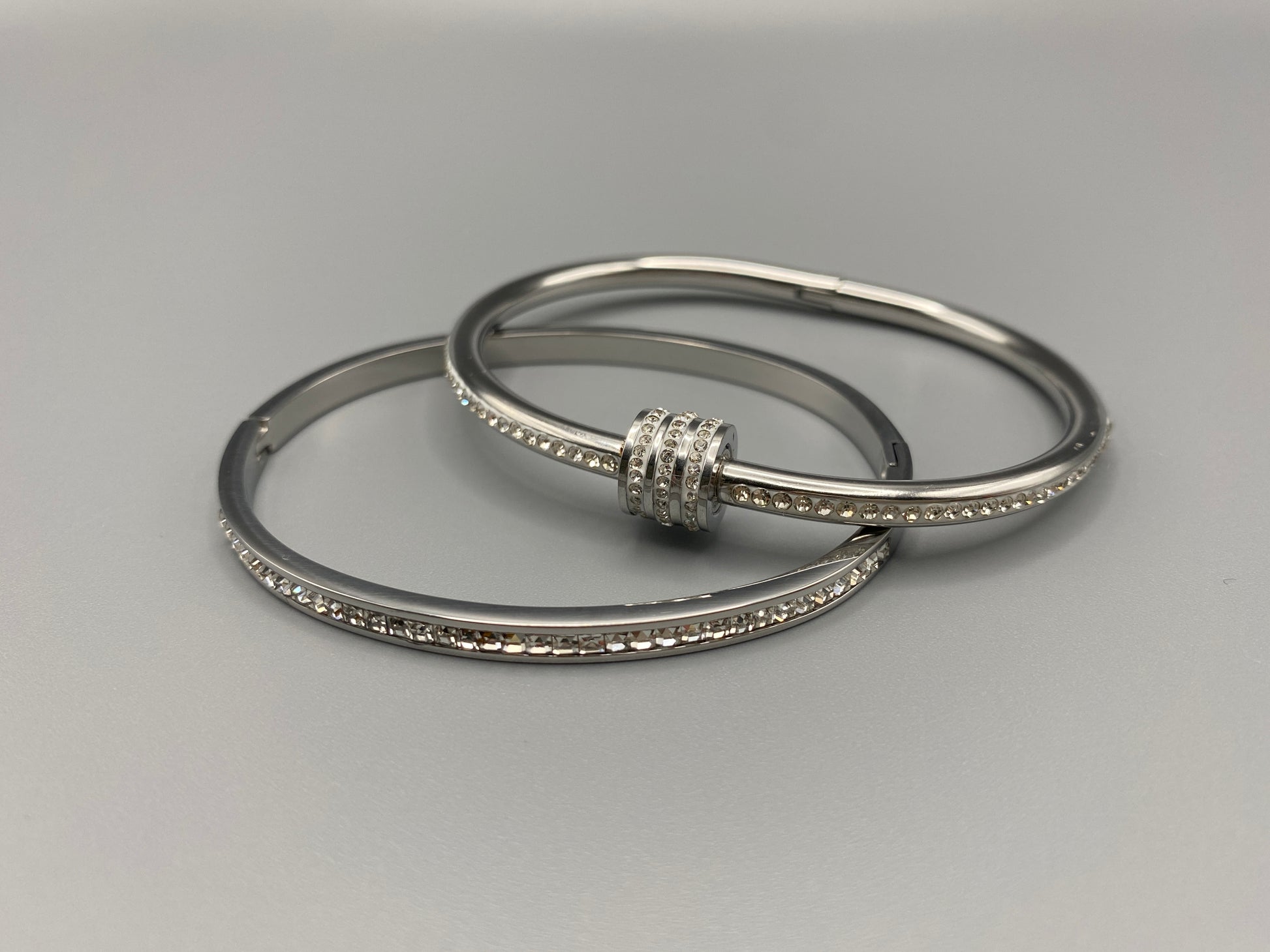 Simone Encrusted Bangle in silver with silver plating and gemstone inlay, offering a radiant and luxurious finish. Durable construction ensures long-lasting wear and tarnish resistance. Perfect for both everyday wear and special occasions.”