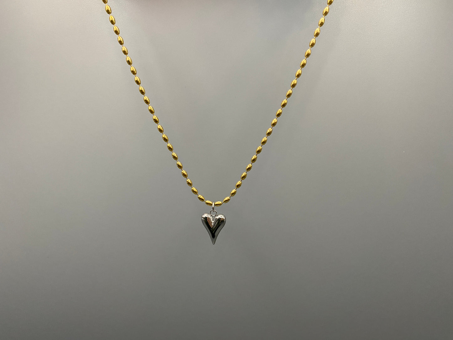 Solara Silver Heart Gold Pendant Necklace. Elegant and charming. 18k gold plated chain with a stainless steel heart pendant. Durable, sophisticated look. Adjustable length: 41 cm + 5 cm extension. Perfect for everyday wear and special occasions.