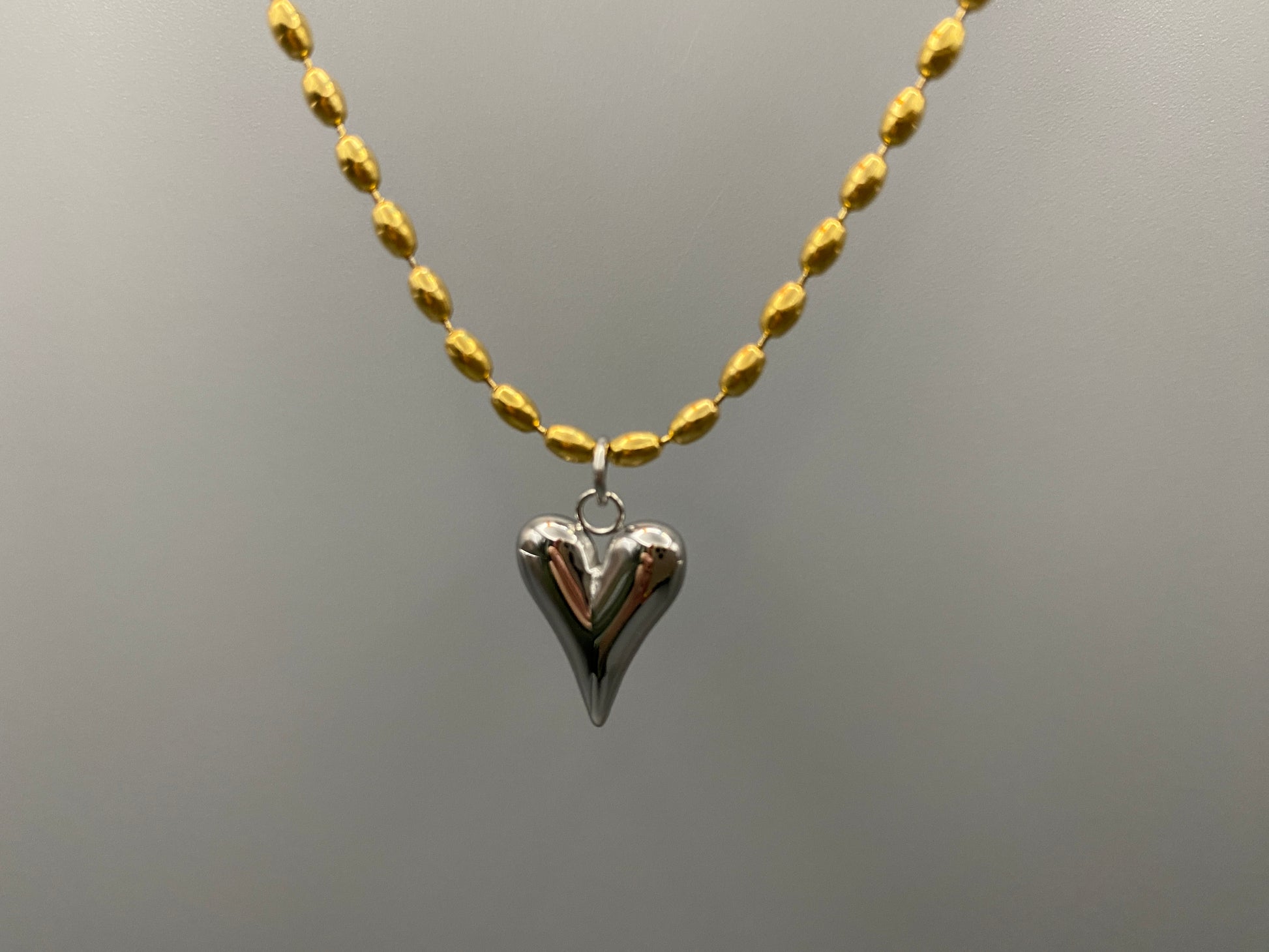 Solara Silver Heart Gold Pendant Necklace. Elegant and charming. 18k gold plated chain with a stainless steel heart pendant. Durable, sophisticated look. Adjustable length: 41 cm + 5 cm extension. Perfect for everyday wear and special occasions.