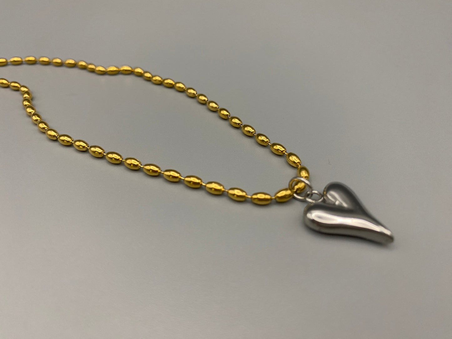 Solara Silver Heart Gold Pendant Necklace. Elegant and charming. 18k gold plated chain with a stainless steel heart pendant. Durable, sophisticated look. Adjustable length: 41 cm + 5 cm extension. Perfect for everyday wear and special occasions.