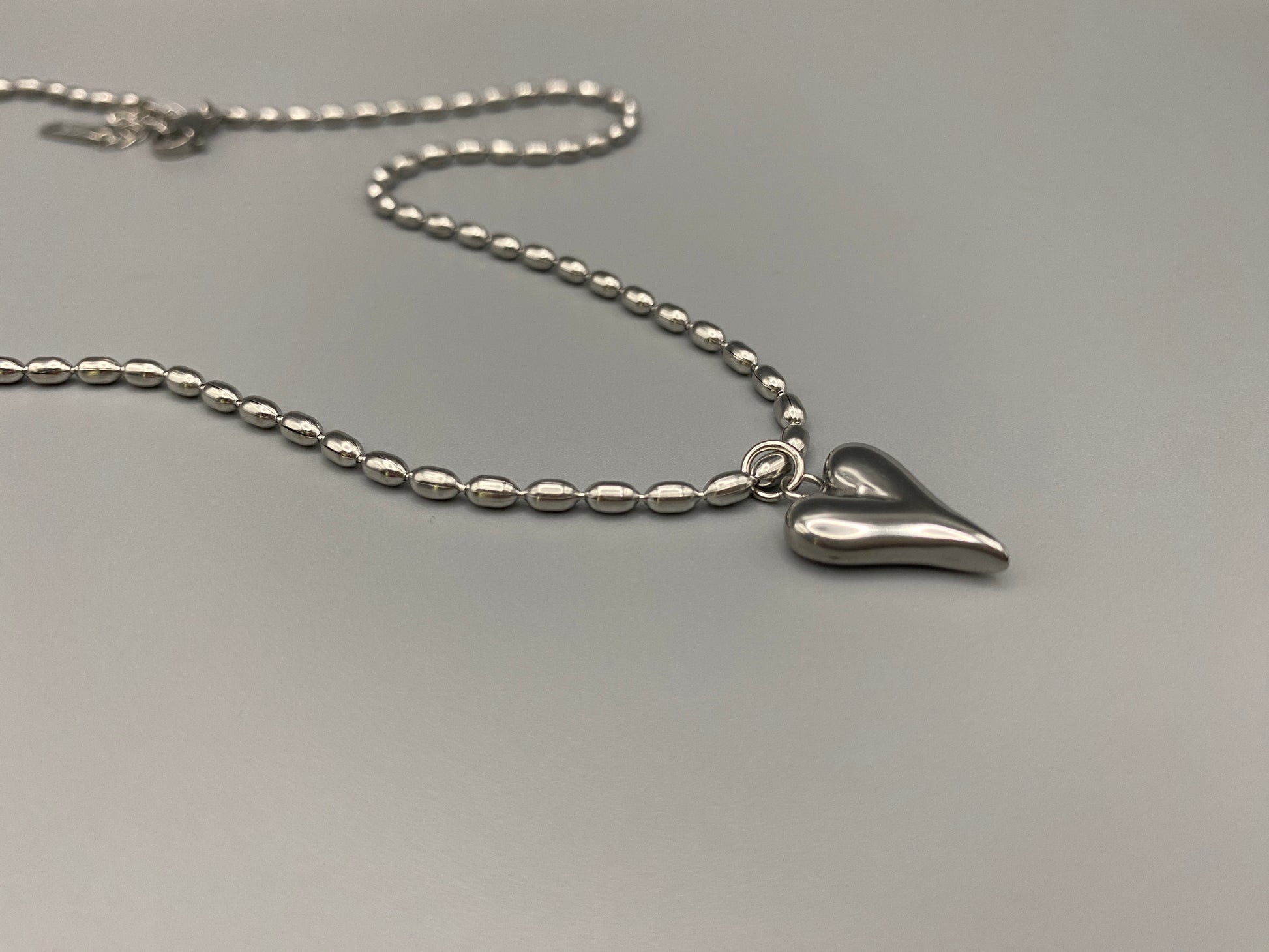 Solara Silver Heart Silver Pendant Necklace. Elegant and charming. Silver chain with a stainless steel heart pendant. Durable, polished finish. Adjustable length: 41 cm + 5 cm extension. Perfect for everyday wear and special occasions.