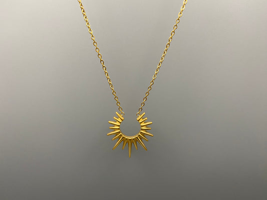 Sunburst Pendant Necklace Gold. Radiant and elegant. 18k gold plated pendant. Waterproof, non-tarnish, non-fade. Length: 45 cm + 5 cm extender. Stainless steel construction. Unique sunburst design.